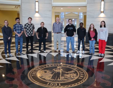 researchers in the Dixon Group in the Shelby Hall Rotunda